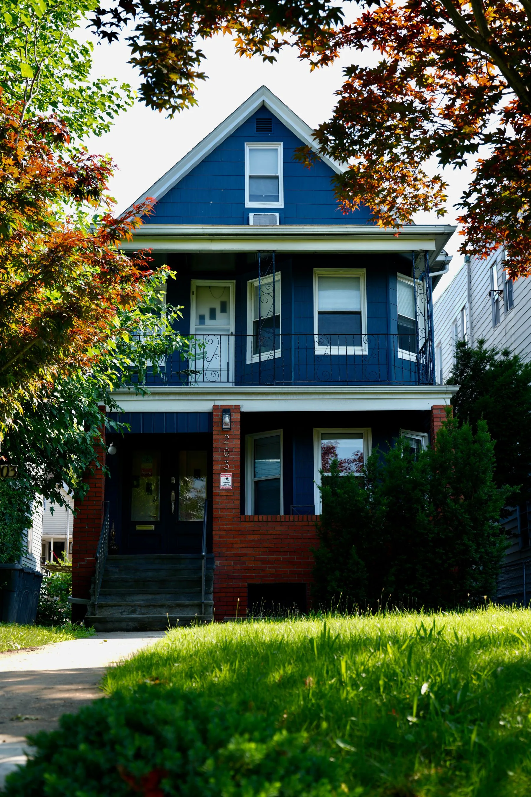 A blue and brick suburban house in New Jersey