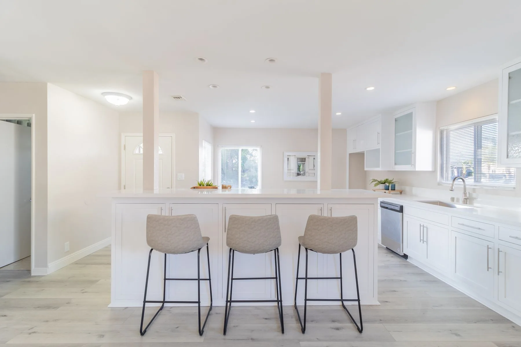 Bright kitchen with built-in appliances and storage cupboards