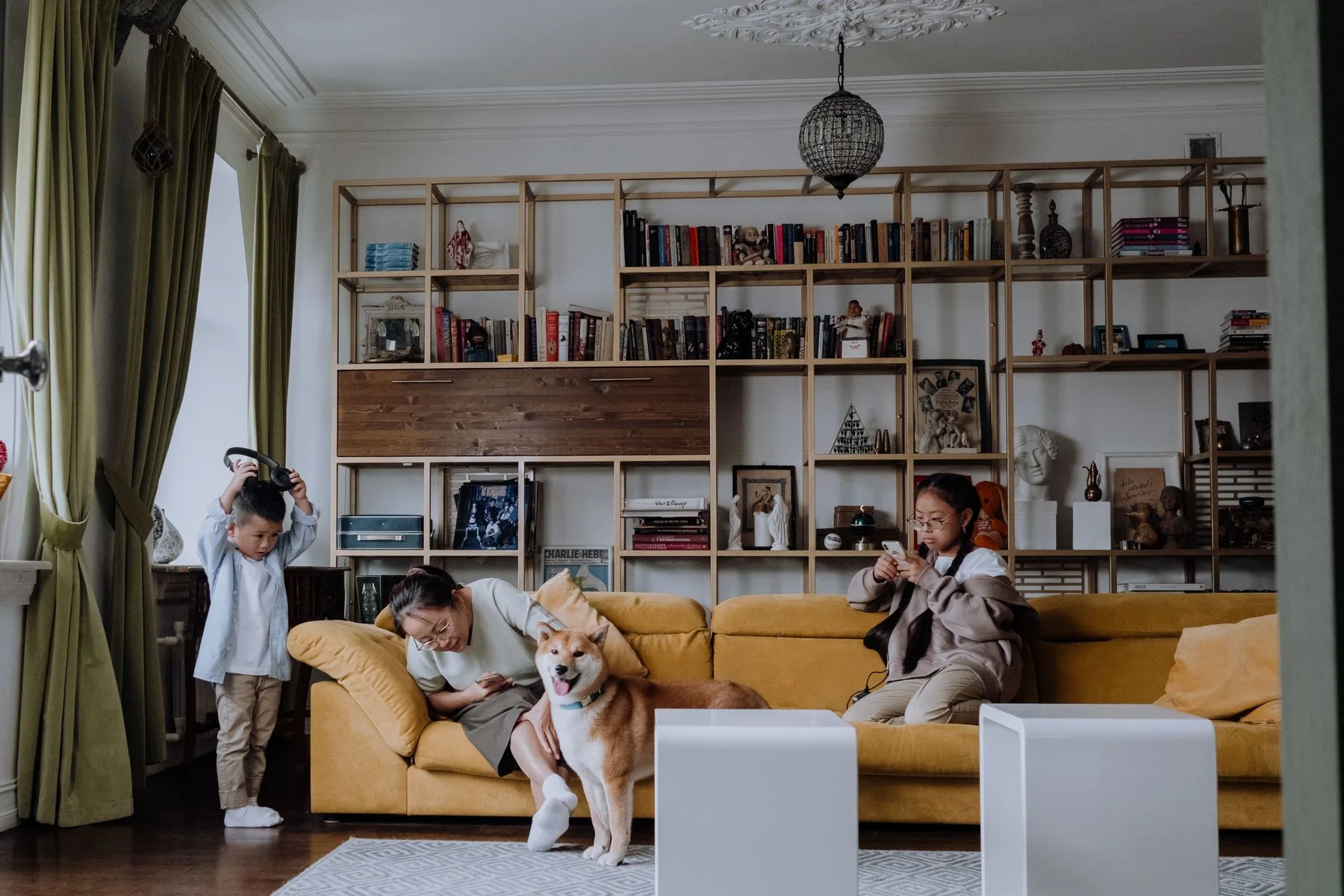 A family spending time with their dog in the living room